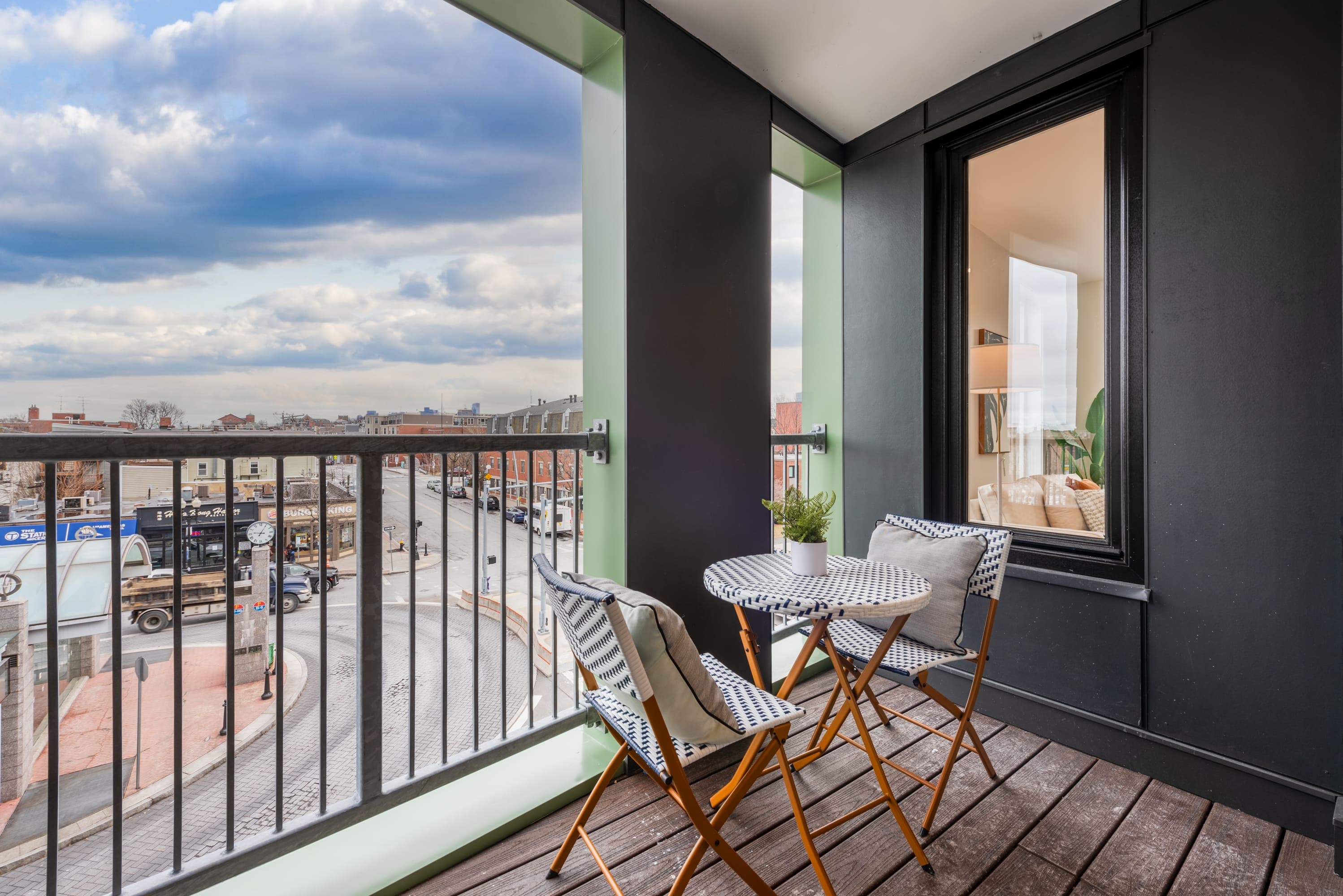Internal balcony view with one charming table and two chairs